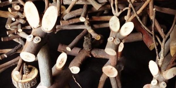 Wooden reindeer decorations made from tree branches.