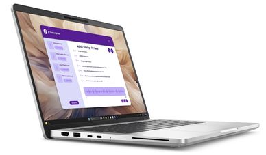 Silver laptop displaying AI transcription software on screen.