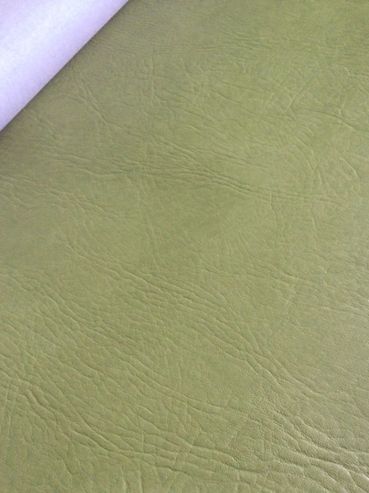 Close-up of green textured leather material.
