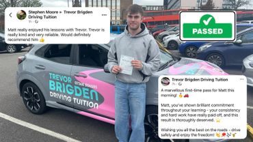 Young man proudly holding his driving test pass certificate beside a driving school car.