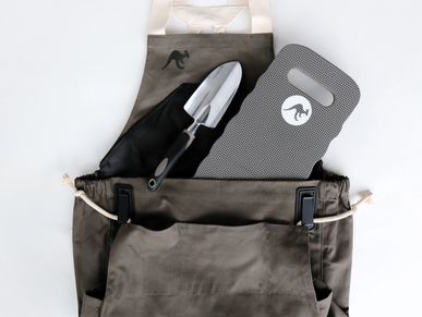 Garden apron with trowel and knee pad inside