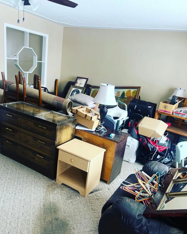 living room full of items for donation pick up