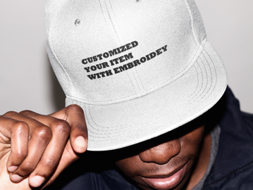 man wear a white snap back cap