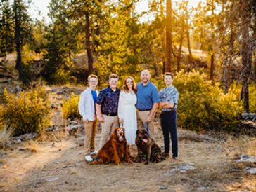 Dr. Lakko with his family in the woods.