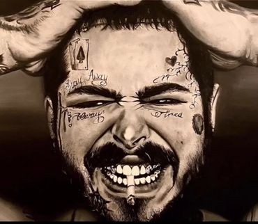 Black and white portrait of a man with facial tattoos and a cigarette.