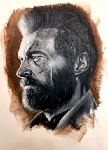 Black and white portrait of a bearded man in profile.