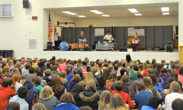 Audience watching an indoor performance.