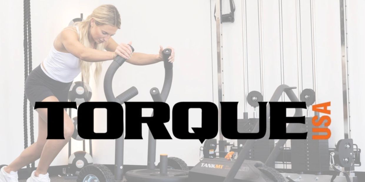 Woman using fitness equipment with TORQUE USA logo overlay.
