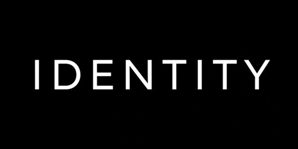 The word 'IDENTITY' in bold white on a black background.