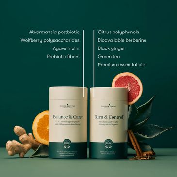 Two nutrition supplement containers with natural ingredients listed and fresh fruits around.