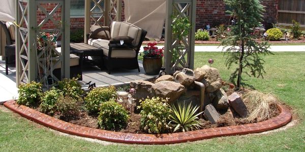 Concrete Curbing Garden Bed Next to Patio