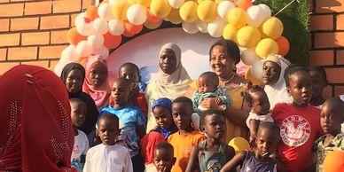 a group picture of children with founder of One Hope for Kidz Organization.