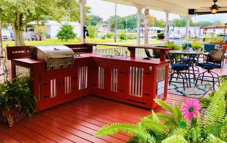 A stained custom outdoor kitchen on a back patio