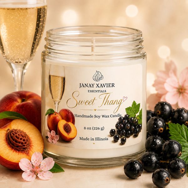 Handmade soy wax candle named Sweet Thang with fruits and flowers.
