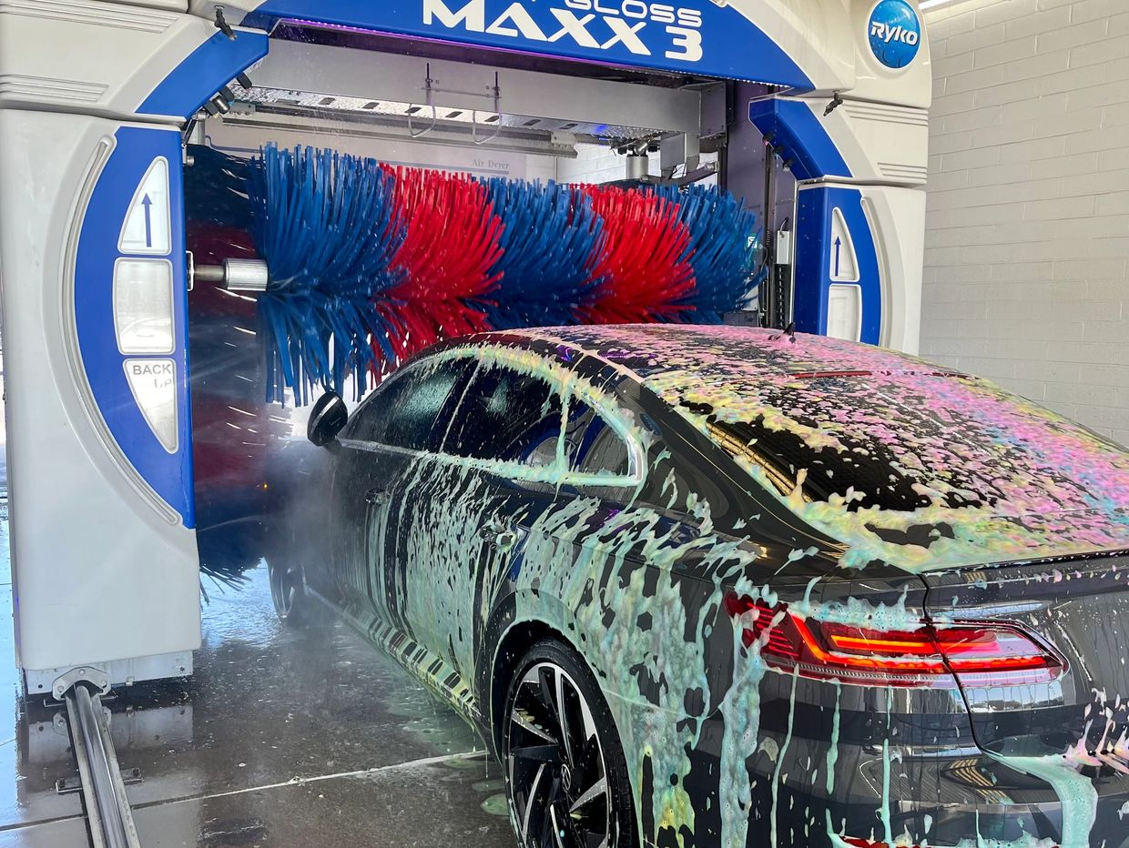 Car entering automatic car wash.