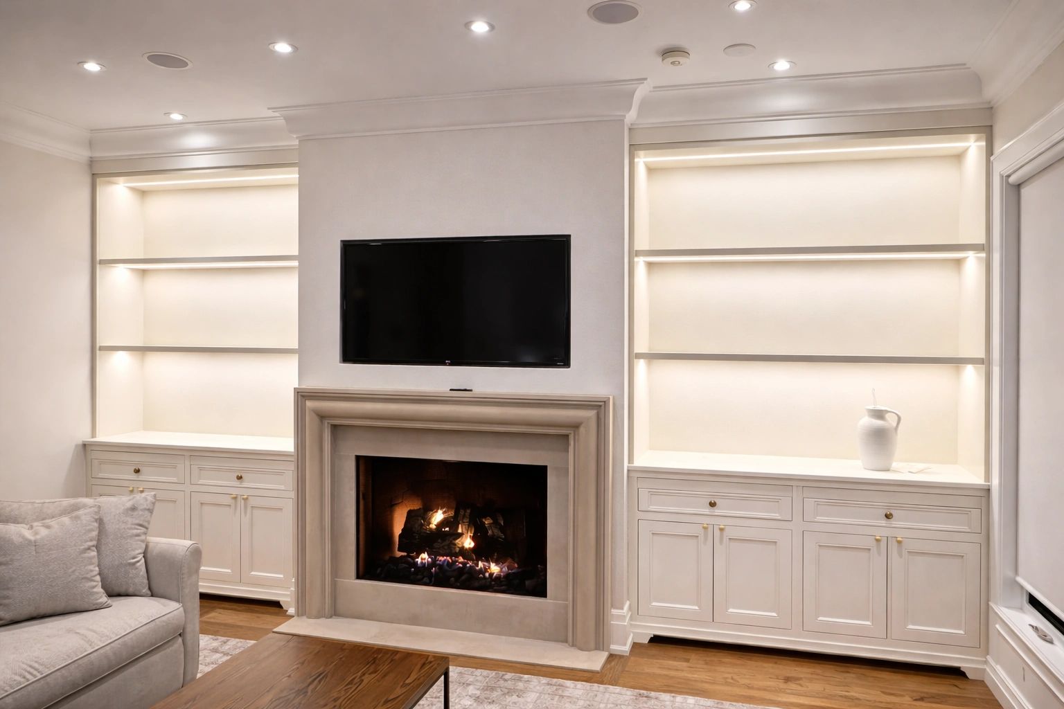 Modern living room with fireplace and built-in shelves.
