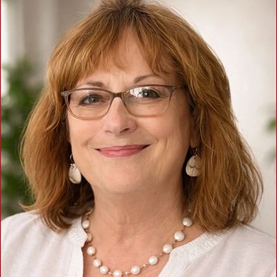 A Woman In A White Color Top