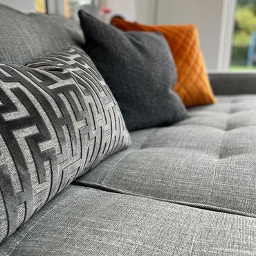 Orange and grey sofa cushions 