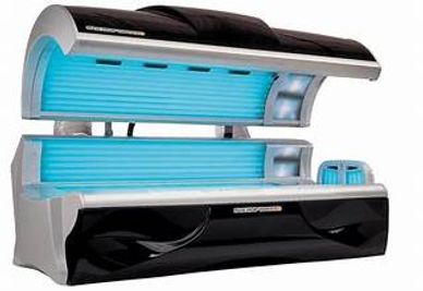Modern indoor tanning bed with blue UV lights.