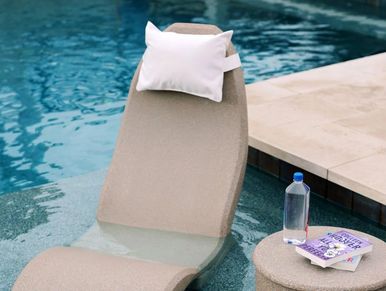 Photo of Pool Lounger, Pillow in White on a High Back Chair.