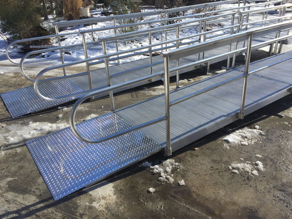 Aluminum fabricated handicap accessible ramp, adjustable transition plate with non skid decking. 