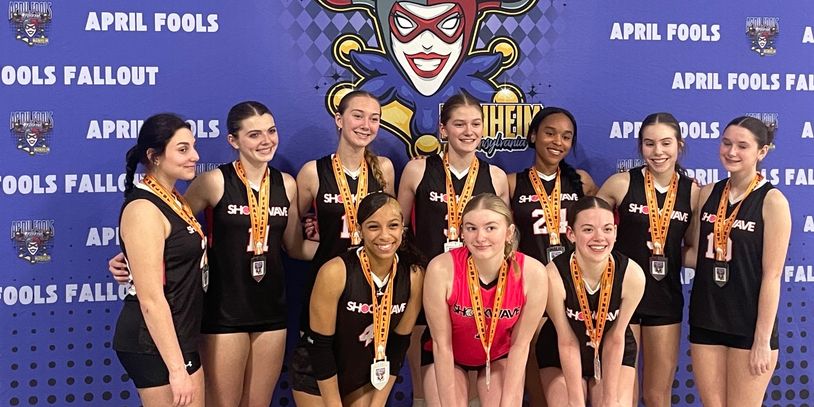 A volleyball team poses with medals at the April Fools Fallout event.