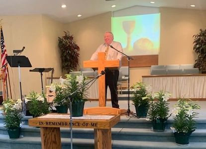 Pastor Tom delivering the Lord's message on Sunday morning.