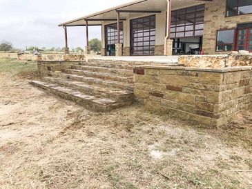 STAIRS OF ROCK FLOWER BEDS MASONRY