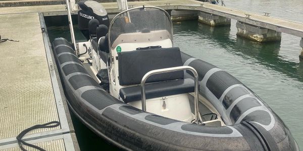 Ribcraft 7.8 metre powerboat alongside a pontoon in Weymouth harbour