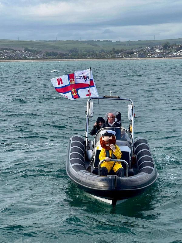 Stormy Stan the RNLI mascot in front of our powerboat