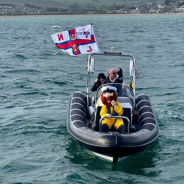 RNLI mascot - Stormy stan in front of Buccaneer during lifeboat celebrations