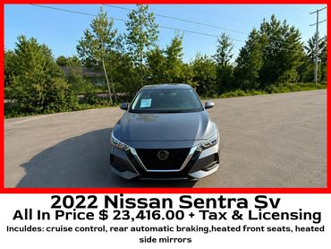 Front view of a 2022 Nissan Sentra SV in a parking lot on a sunny day.