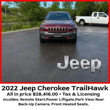 Front view of a 2022 Jeep Cherokee TrailHawk on a wet pavement.