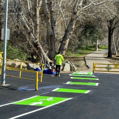 Bicycle Lane Asphalt, Bike Lane Asphalt Line Striping for a park and vehicle traffic area.  Safety