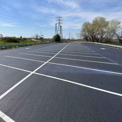Seal Coating & restriping commercial business  parking lot in Bakersfield, CA  Sun and Weather faded