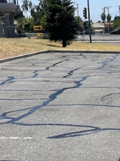 Extensive crack filling and prep work for a commercial parking lot before sealcoating.