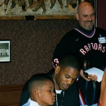 Former Raptor Antonio Davis and his son at an event hosted by Coach Duffy.