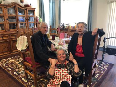 Three family members enjoying time together at home.