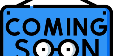 Blue sign with "COMING SOON" text and glasses illustration.
