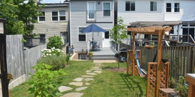 Finished backyard deck, pergola and flagstone path built by Beattie Home Renovations