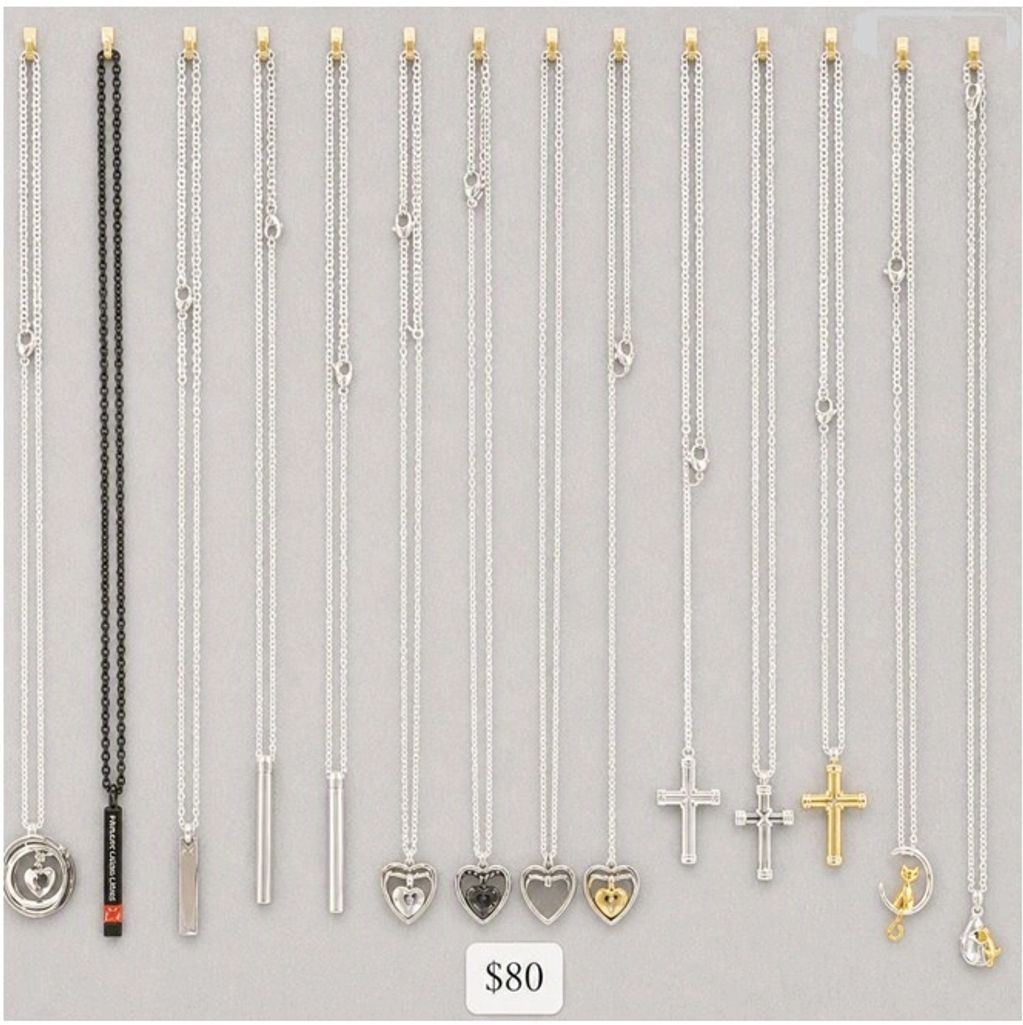 Assorted silver and gold chains with various pendants.