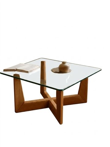 Modern glass-top table with wooden base.