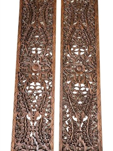 Handcrafted wooden wall panel with geometric pattern.