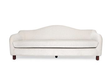 Elegant white upholstered sofa with curved backrest.