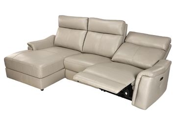 Modern beige leather sectional sofa with recliner and chaise lounge.