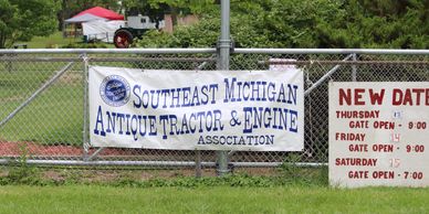 Banner for Southeast Michigan Antique Tractor &amp; Engine Association at an event.