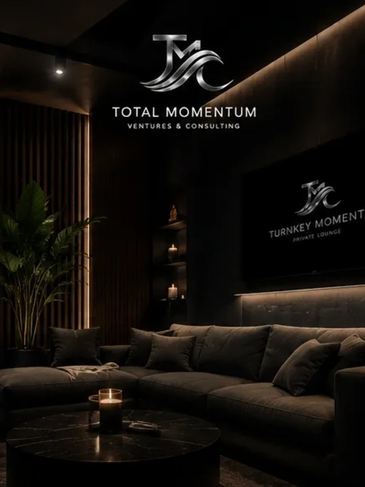 Luxurious lounge with dark tones, candles, and plush seating under the Total Momentum logo.