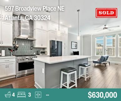 Modern kitchen and living area in a newly sold Atlanta home.