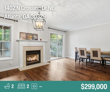 Living room with fireplace and dining area.