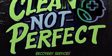 Sign reads 'Clean Not Perfect' promoting recovery services.